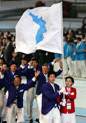 North Korea and South Korea's athletes enter the field holding hands and waving an unification flag during the opening ceremony of the 4th East Asian Games in Macau October 29, 2005.