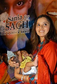 Indian tennis player Sania Mirza holds Umesh, 3, who suffers from a heart disease, during a function organized by 'Save a Child's Heart Foundation' in Hyderabad, India, in this Wednesday, Sept. 28, 2005, file photo.