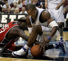 Charlotte Bobcats' Jurmaine Jones, left, battles Orlando Magic's Steve Francis for a loose ball in Orlando, Fla., Tuesday, Nov. 15, 2005.