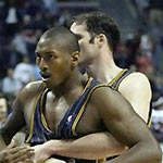 Indiana Pacers' Ron Artest is restrained by Austin Croshere before being escorted off the court following their fight with the Detroit Pistons and fans in this Nov. 19, 2004 photo, in Auburn Hills, Mich.
