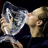 Argentina's David Nalbandian kisses the champion trophy during award presentation after defeating world number one, Switzerland's Roger Federer in the singles final in the Shanghai Tennis Masters Cup held at the Qi Zhong stadium in Shanghai, China, Sunday, Nov. 20, 2005. 