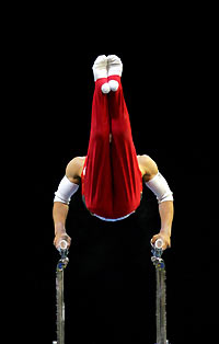 Hiroyuki Tomita of Japan competes in the rings event during the men's all around final at the World Gymnastics Championships at Rod Laver Arena in Melbourne November 24, 2005. 