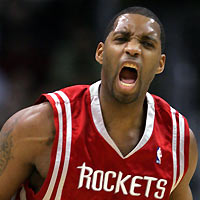 Houston Rockets Tracy McGrady celebrates after scoring against the Los Angeles Lakers during the third quarter of their NBA game in Los Angeles December 18, 2005. The Rockets won 76-74 and McGrady was the high scorer with 20 points.