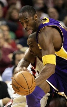 Los Angeles Lakers guard Kobe Bryant, right, chases down the ball after stealing it from Portland Trail Blazers guard Juan Dixon during first quarter NBA basketball action in Portland, Ore., Wednesday, Jan. 11, 2006.(