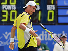 Lleyton Hewitt of Australia bounces his racket after missing a shot during his loss to Andreas Seppi of Italy at the Sydney International tennis tournament January 12, 2006. Seppi won 4-6 7-5 7-5.