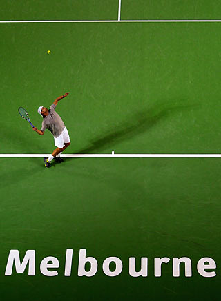 Andy Roddick of the U.S. serves to Michael Lammer of Switzerland at the Australian Open tennis tournament in Melbourne January 16, 2006. 