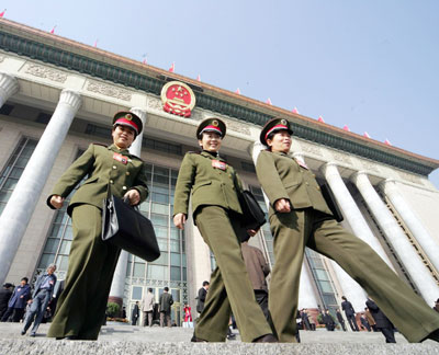 Chinese military delegates walk out of the Great Hall of the People in Beijing March 4, 2006. The National People's Congress, an annual two-week government gathering in Beijing where major policy decisions are made, will start on Sunday.