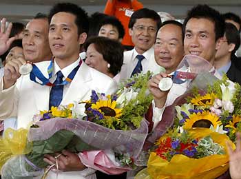 Chinese athletes return home