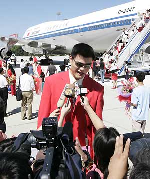 Chinese athletes return home