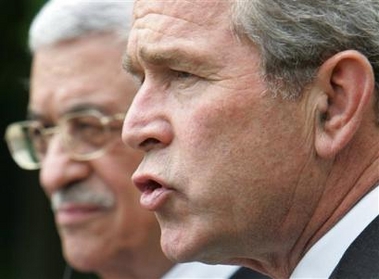 Bush embraces Abbas as courageous reformer