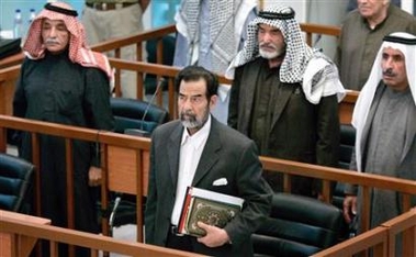 Saddam trial to resume with some hidden witnesses