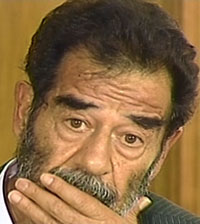 Saddam appears as Iraqis cheer, curse