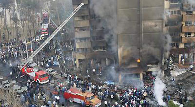 Iran plane crashes into building, 116 dead