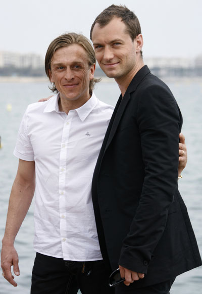 Jude Law and director Jeremy Gilley pose for 