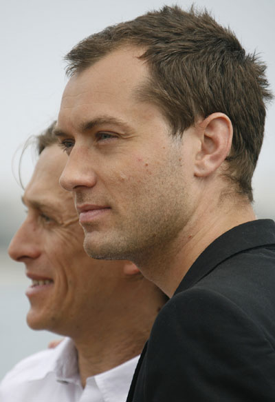 Jude Law and director Jeremy Gilley pose for 