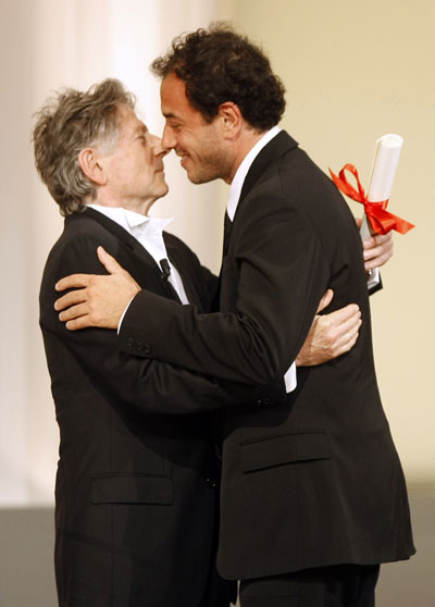 Director Polanski congratulates Italian director Garrone for his Grand Prix award for film 