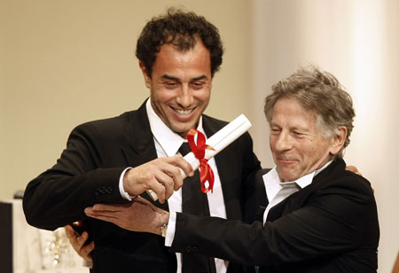 Director Polanski congratulates Italian director Garrone for his Grand Prix award for film 