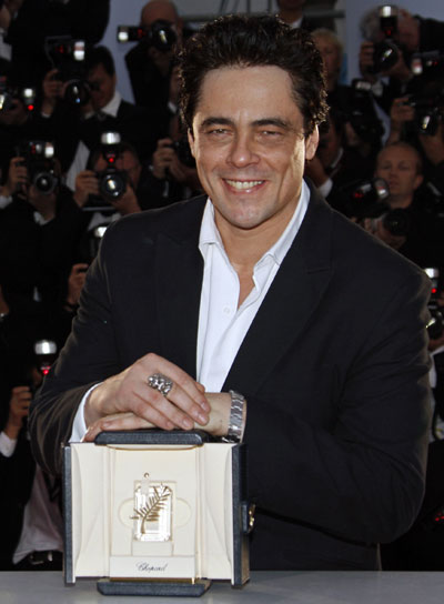 Actor Benicio Del Toro poses with the Best Actor award for the film 