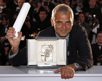 French director Cantet poses after he received the Palme d'Or award for the film 