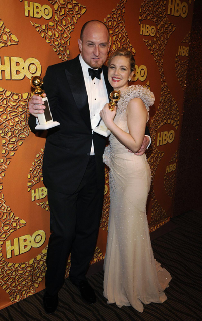 Drew Barrymore holds a Golden Globe for her work in 