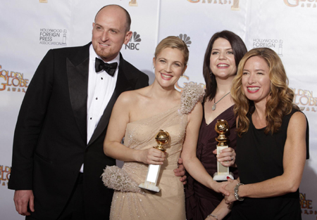 Drew Barrymore holds a Golden Globe for her work in 