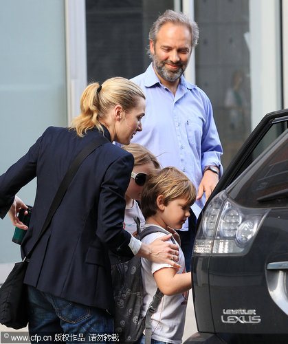 Kate Winslet and Sam Mendes step out again without rings for kids