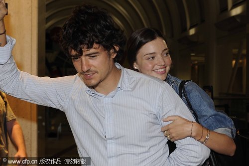 Orlando Bloom and Miranda Kerr return from honeymoon