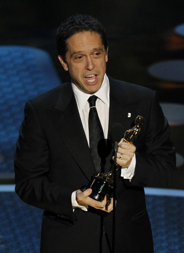 Director Lee Unkrich accepts the Oscar for best animated feature film