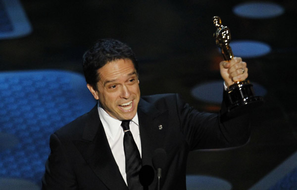 Director Lee Unkrich accepts the Oscar for best animated feature film