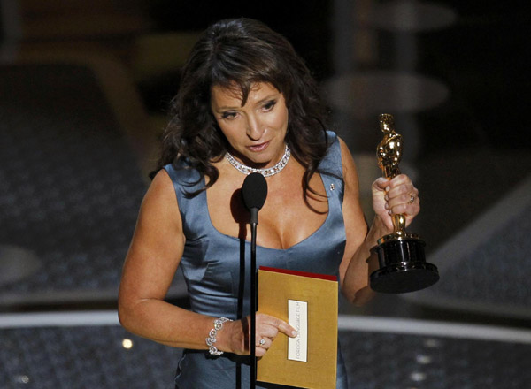 Director Susanne Bier (L) accepts the Oscar for best foreign film