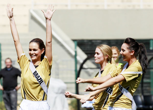 Miss Universe 2011 contestants play football in Sao Paulo