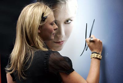 Maria Sharapova poses before launching her new TAG Heuer watch 