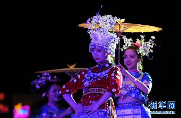 Foreign models showcase traditional Miao costumes in Guizhou