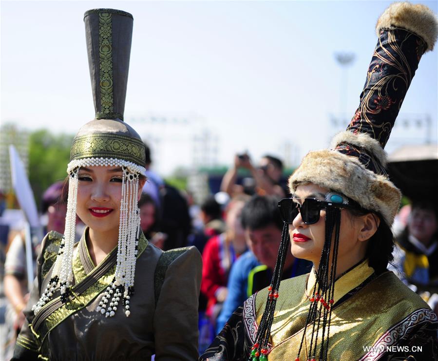 Models present costumes in China's Inner Mongolia