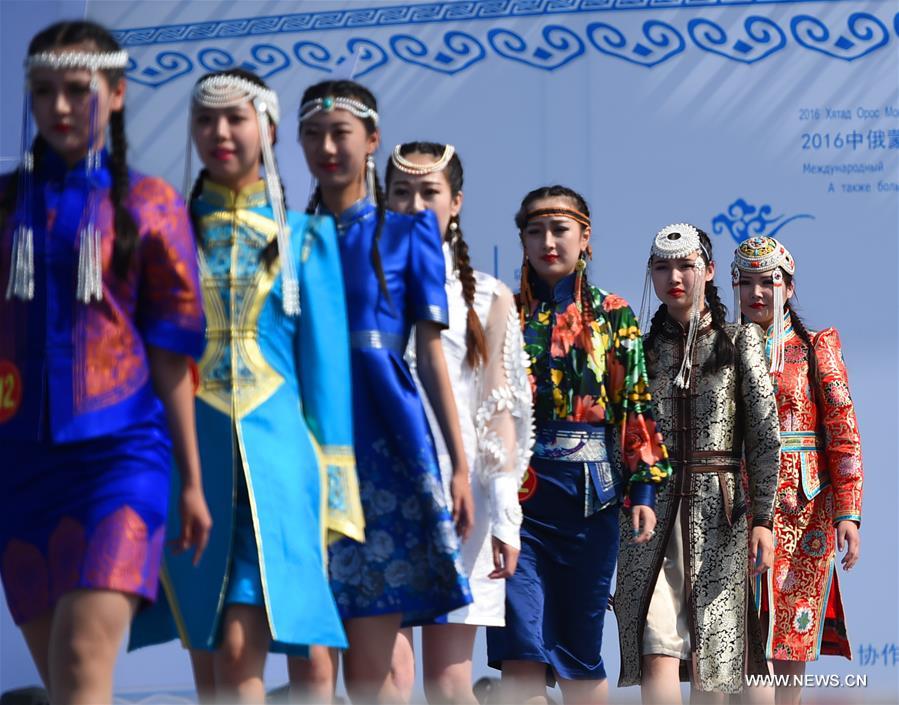 Models present costumes in China's Inner Mongolia