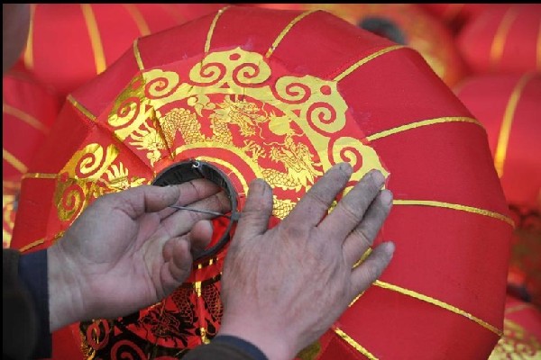 Villagers make red lanterns to greet Spring Festival in China's Shanxi