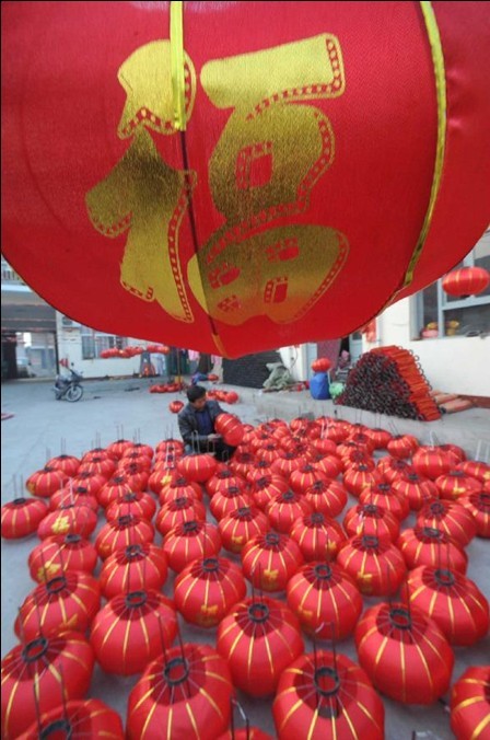 Villagers make red lanterns to greet Spring Festival in China's Shanxi