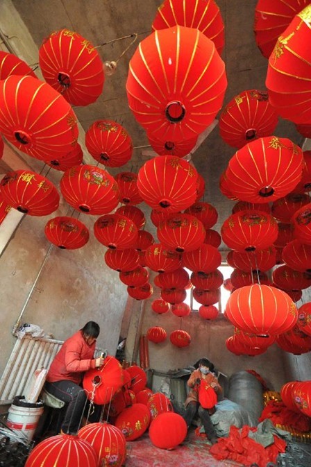 Villagers make red lanterns to greet Spring Festival in China's Shanxi