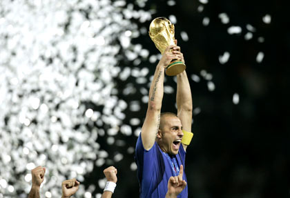 Italy's Fabio Cannavaro lifts the World Cup Trophy after the World Cup 2006 final soccer match between Italy and France in Berlin July 9, 2006. [Reuters]