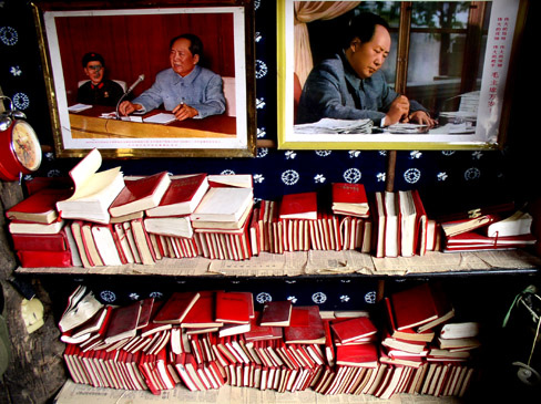 The slate rooftops, cobblestone streets and whispering canals of Lijiang in northern Yunnan have made it China's number one tourist destination. There in the city's Old Town are countless small boutiques of souvenirs, including the popular Cultural Revolution-era quotations of Chairman Mao Zedong (pictured).