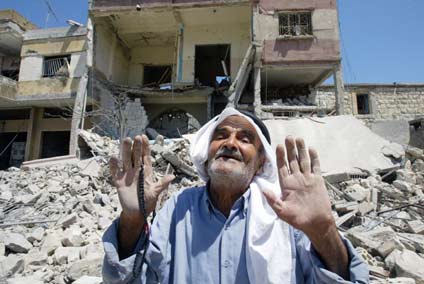 An elderly man talks to the media in Bint-Jbeil town in south Lebanon August 15, 2006. Israeli forces began leaving parts of south Lebanon on Tuesday as a UN truce largely held for a second day and the Lebanese army prepared to move south. [Reuters]