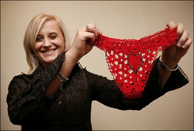 Malgorzata Sanaszek, who employs over 60 workers in her underwear factory, smiles as she presents a hand made frilly g-string, 18 January 2007, in Koniakow, Poland. Faced with declining demand for their intricate doilies, the lacemakers of this Polish mountain community came up with a solution: sexy underwear.(AFP/File/Wojtek Radwanski) 