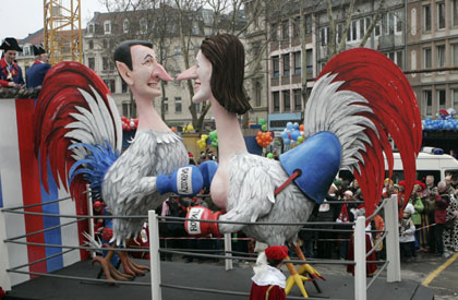 A carnival float shows a papier-mache figure representing France's presidential candidates Nicolas Sarkozy (L) and Segolene Royal during the traditional Rose Monday carnival parade in the western German town of Cologne February 19, 2007. The Rose Monday parades in Cologne, Mainz and Duesseldorf are the highlight of the German street carnival season.