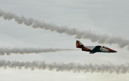 A member of the Spanish Air Force acrobatic group 'Patrulla Aguila' (Eagle Patrol) flies over Samil beach in Vigo, northern Spain, during an aerial exhibition July 22, 2007. 