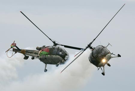 Members of the Portuguese acrobatic group 'Rotores de Portugal' (Portugal's rotors) fly over Samil beach in Vigo, northern Spain, during an aerial exhibition July 22, 2007. 