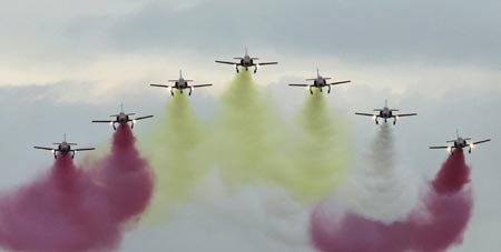 Members of the Spanish Air Force acrobatic group 'Patrulla Aguila' fly over Samil beach in Vigo, northern Spain during an aerial exhibition July 22, 2007. 