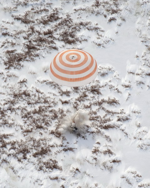 Space travelers on Russia's Soyuz spacecraft return to Earth