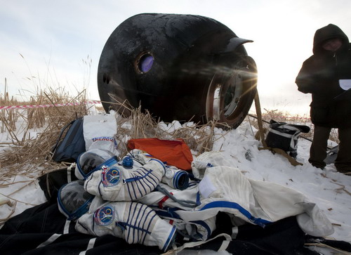 Space travelers on Russia's Soyuz spacecraft return to Earth