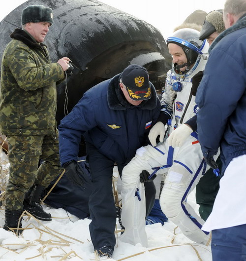 Space travelers on Russia's Soyuz spacecraft return to Earth