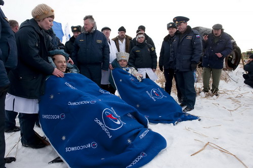 Space travelers on Russia's Soyuz spacecraft return to Earth